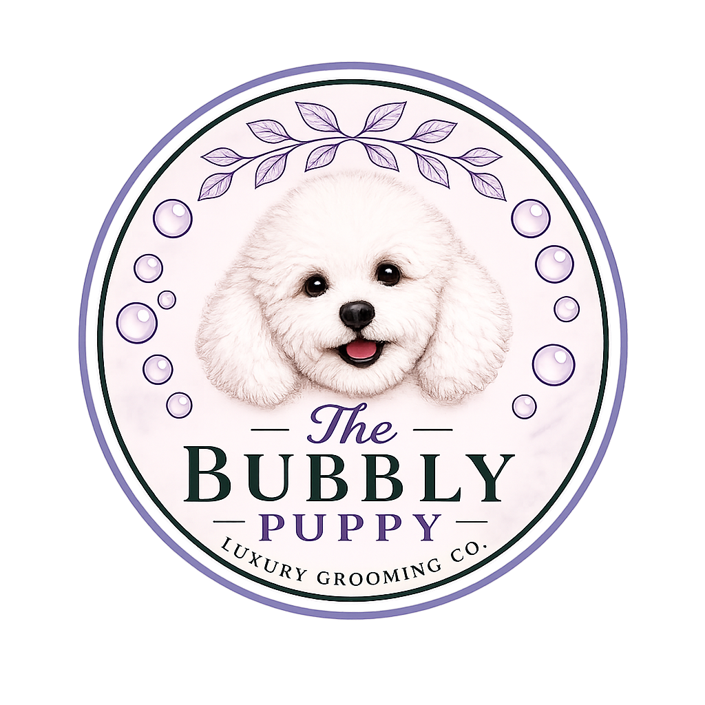 Logo for The Bubbly Puppy Luxury Grooming Co. featuring a cute, white, fluffy puppy with a happy expression, surrounded by decorative purple leaves and bubbles.