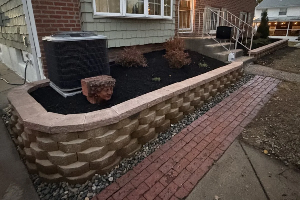 A garden wall and plant install in the front yard of house in Bellmawr, NJ.