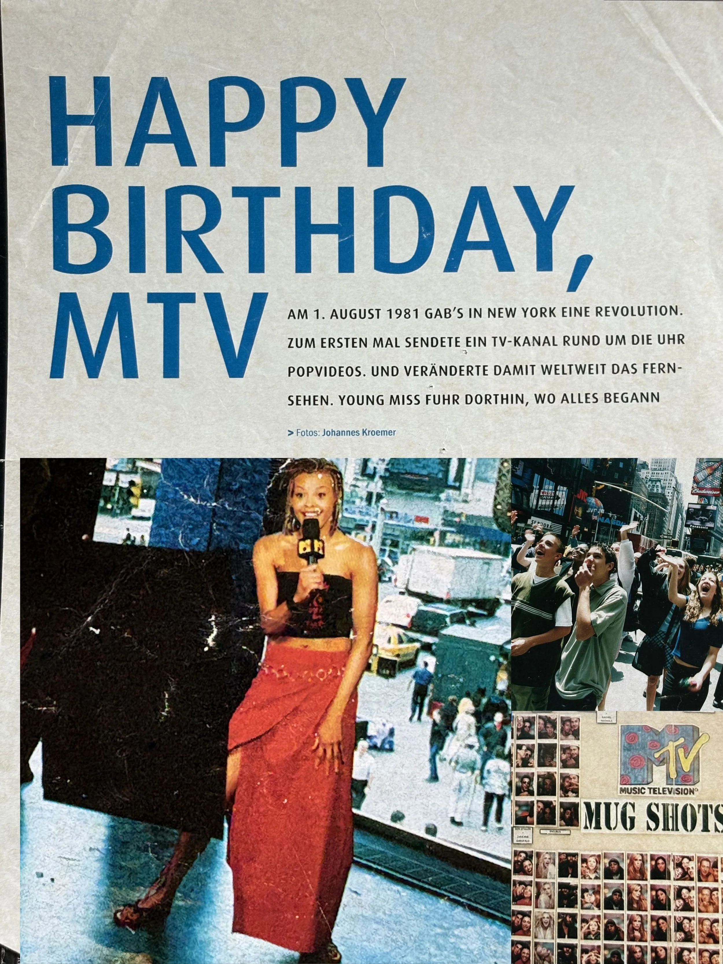 A young Erickka Jones in a red skirt and black top holding a microphone, standing outside near a MTV music television store with a crowd of people walking in the background for MTV's anniversary in Times Sq. New York. 