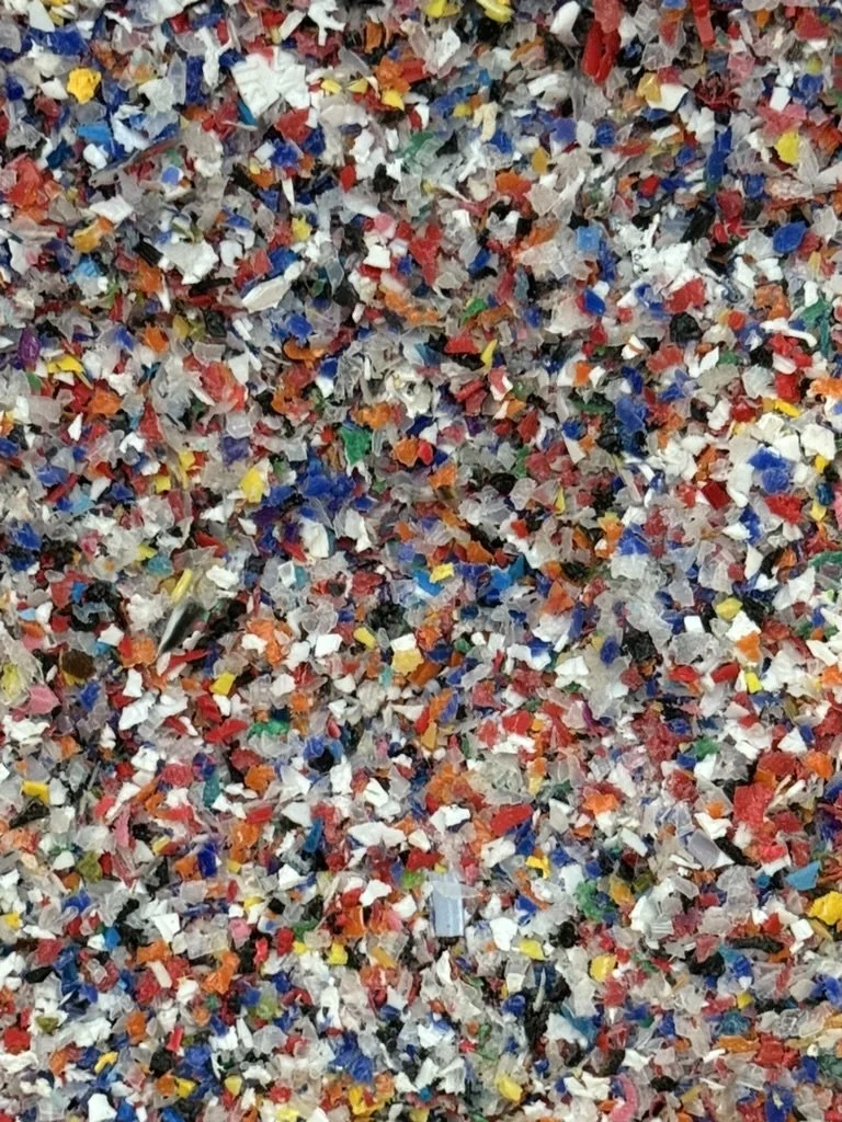Close-up of shredded colorful plastic or paper material.