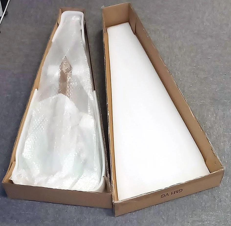 Fibre-based protective guitar packaging made from corrugated and kraft paper components replacing plastic foam and bubble wrap