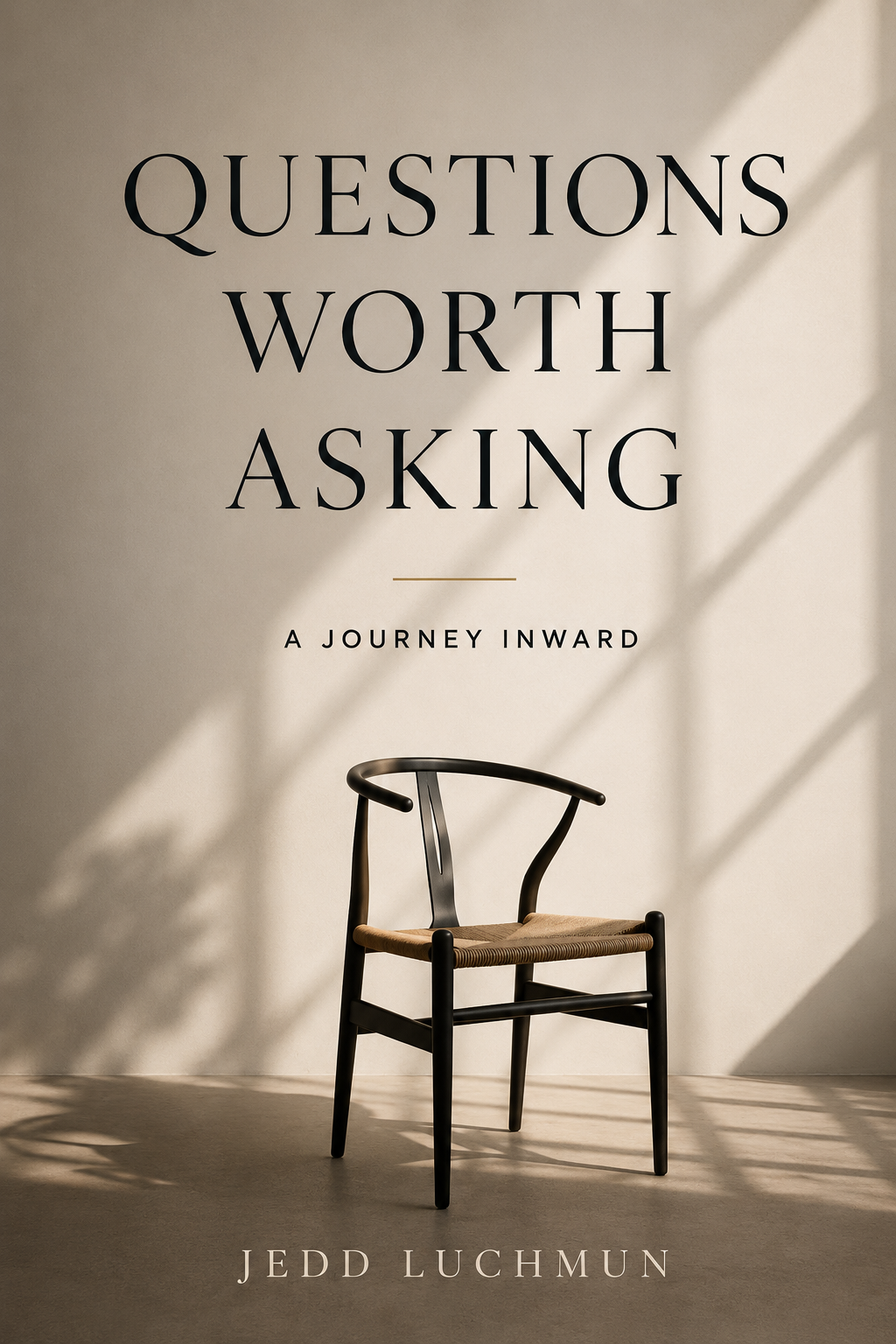 Book cover titled "Questions Worth Asking: A Journey Inward" by Jedd Luchmun, featuring a minimalist design with a single chair casting shadows on the wall.