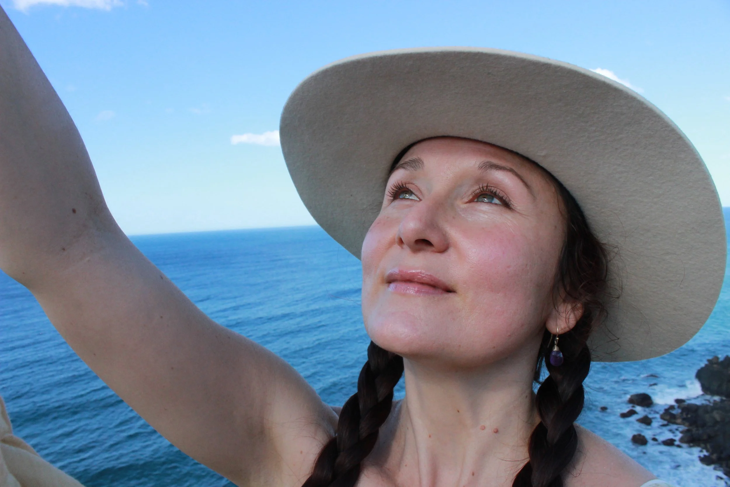 close up face ocean eyes up to sun.JPG