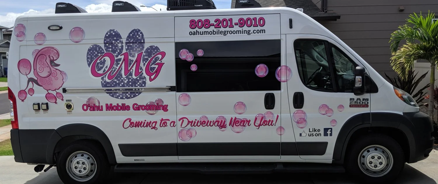 Oahu mobile grooming van parked in driveway near you