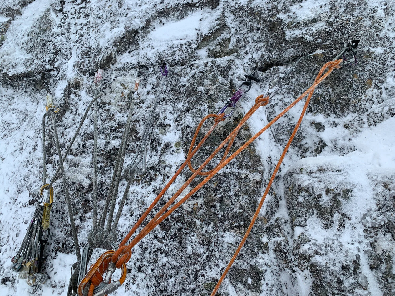 Another 7 piece belay, this time in Scotland whilst mixed climbing. Oddly colour coordinated rope and carabiners through absolute chance.