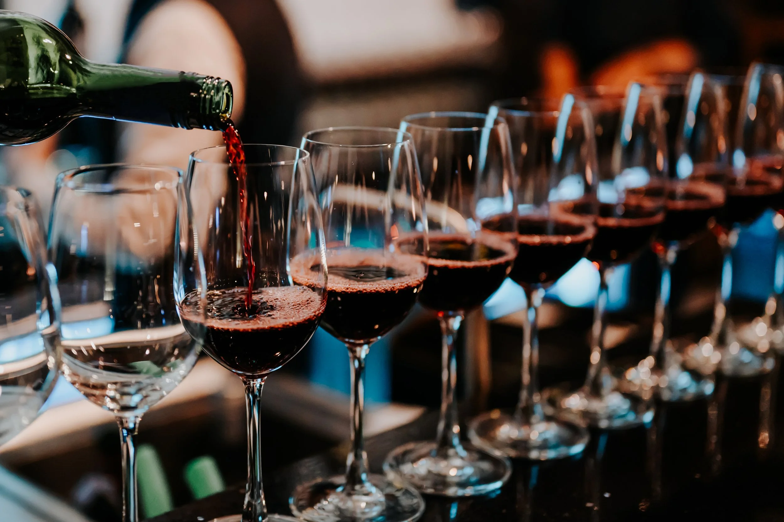bartender-pours-red-wine-in-glasses-at-bar-male-so-2026-03-17-08-25-55-utc.jpg