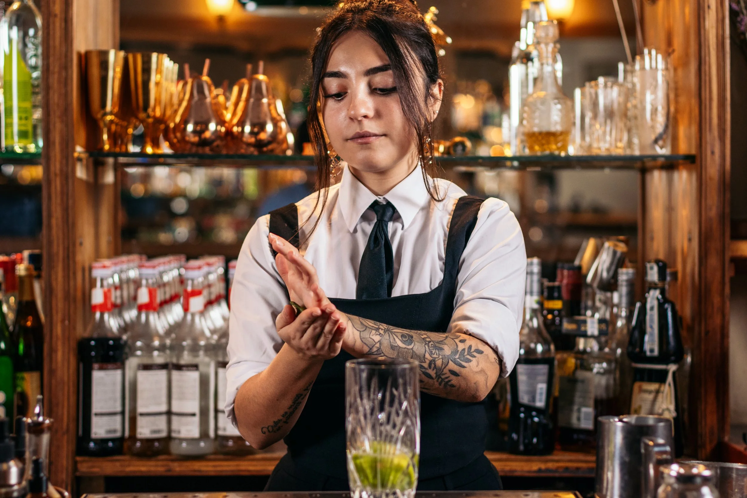 female-bartender-preparing-a-cocktail-in-a-traditi-2026-03-24-07-50-36-utc.jpg