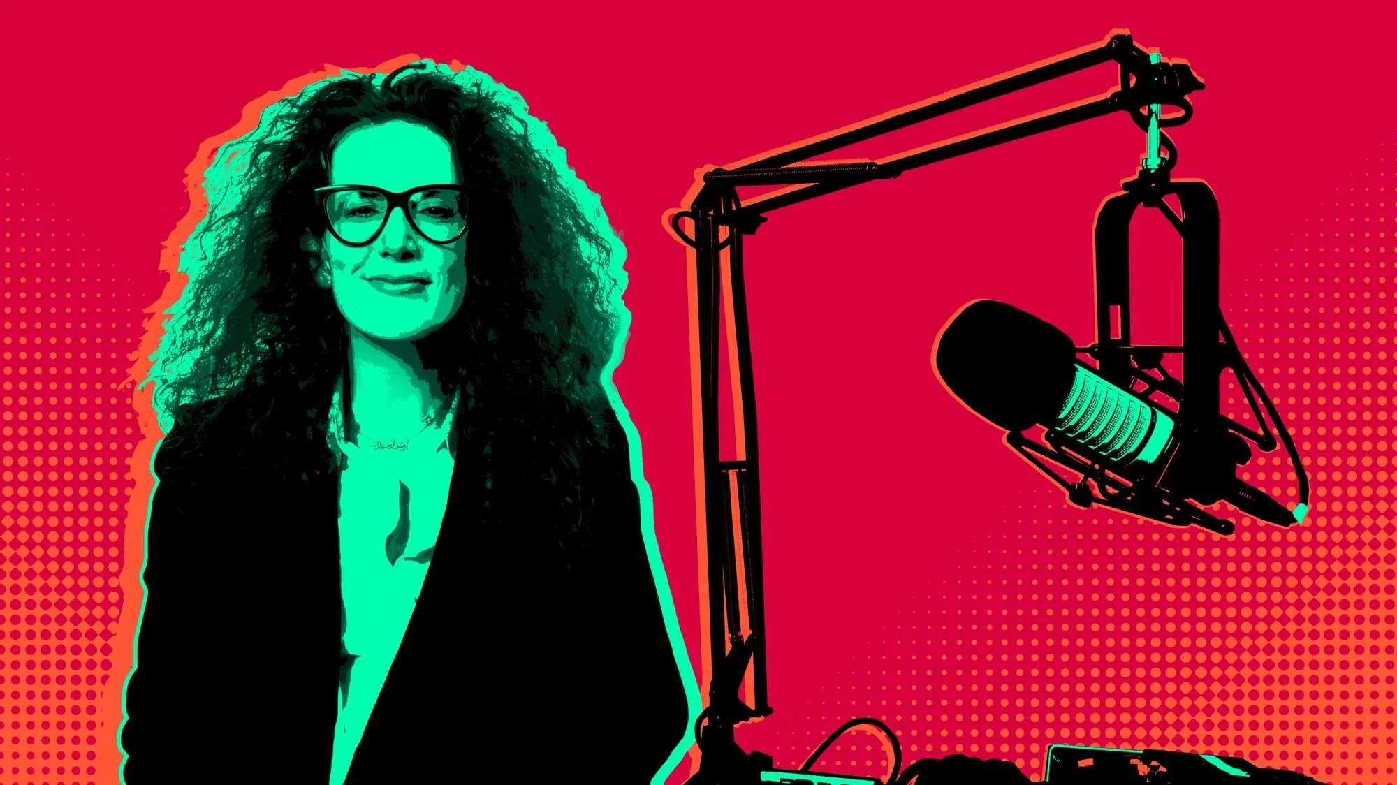A woman with curly hair and glasses sitting in front of a microphone during a recording session, with a red background and a dotted pattern.