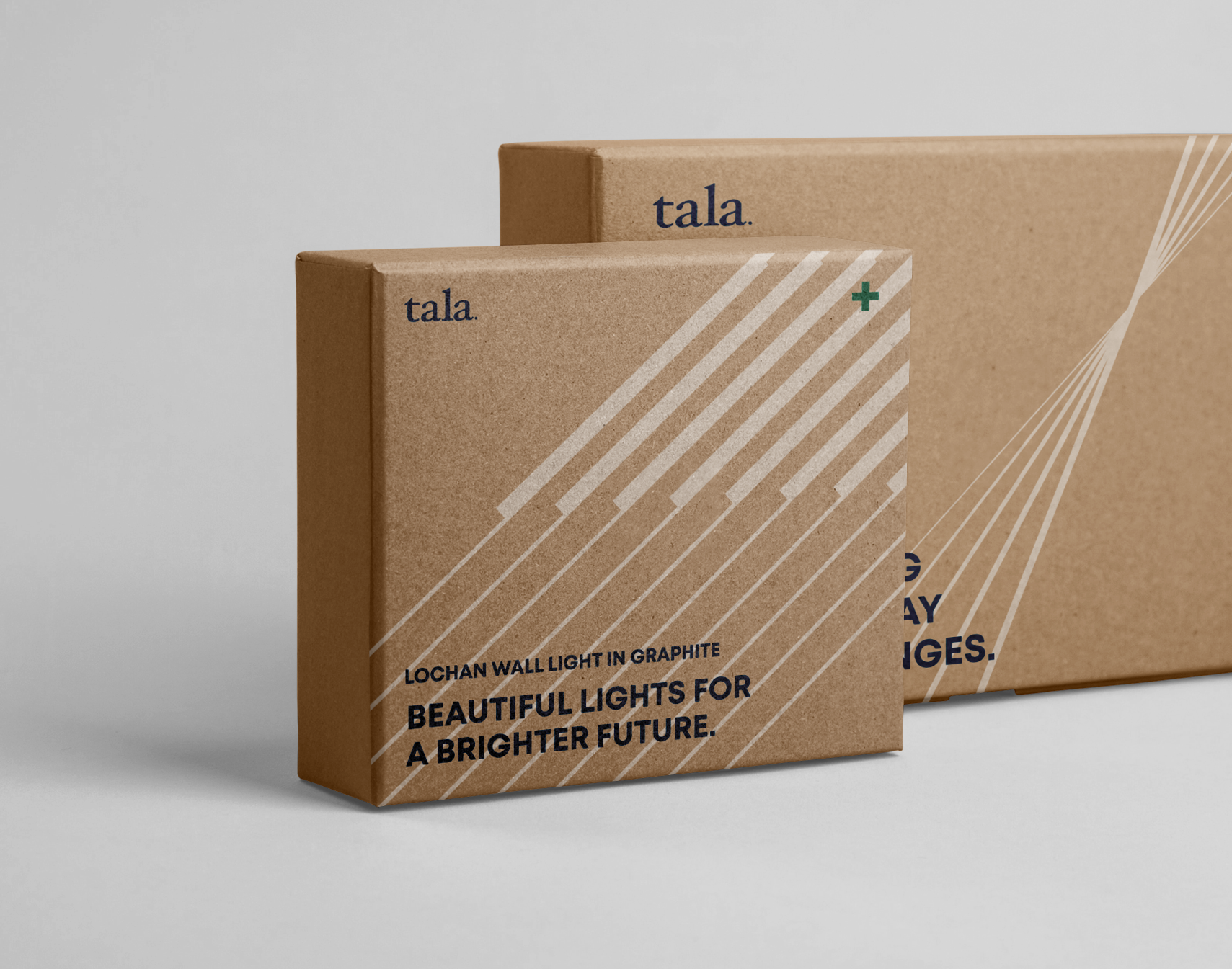 Two square Tala branded packaging boxes featuring clean typography and dynamic line assets.