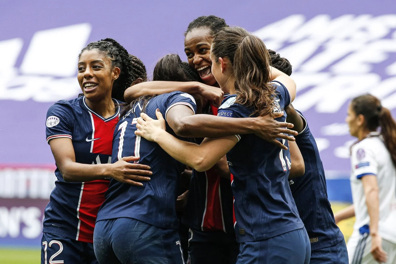 Paris Saint-Germain women's football team in a huddle, representing ATA Football broadcasting.