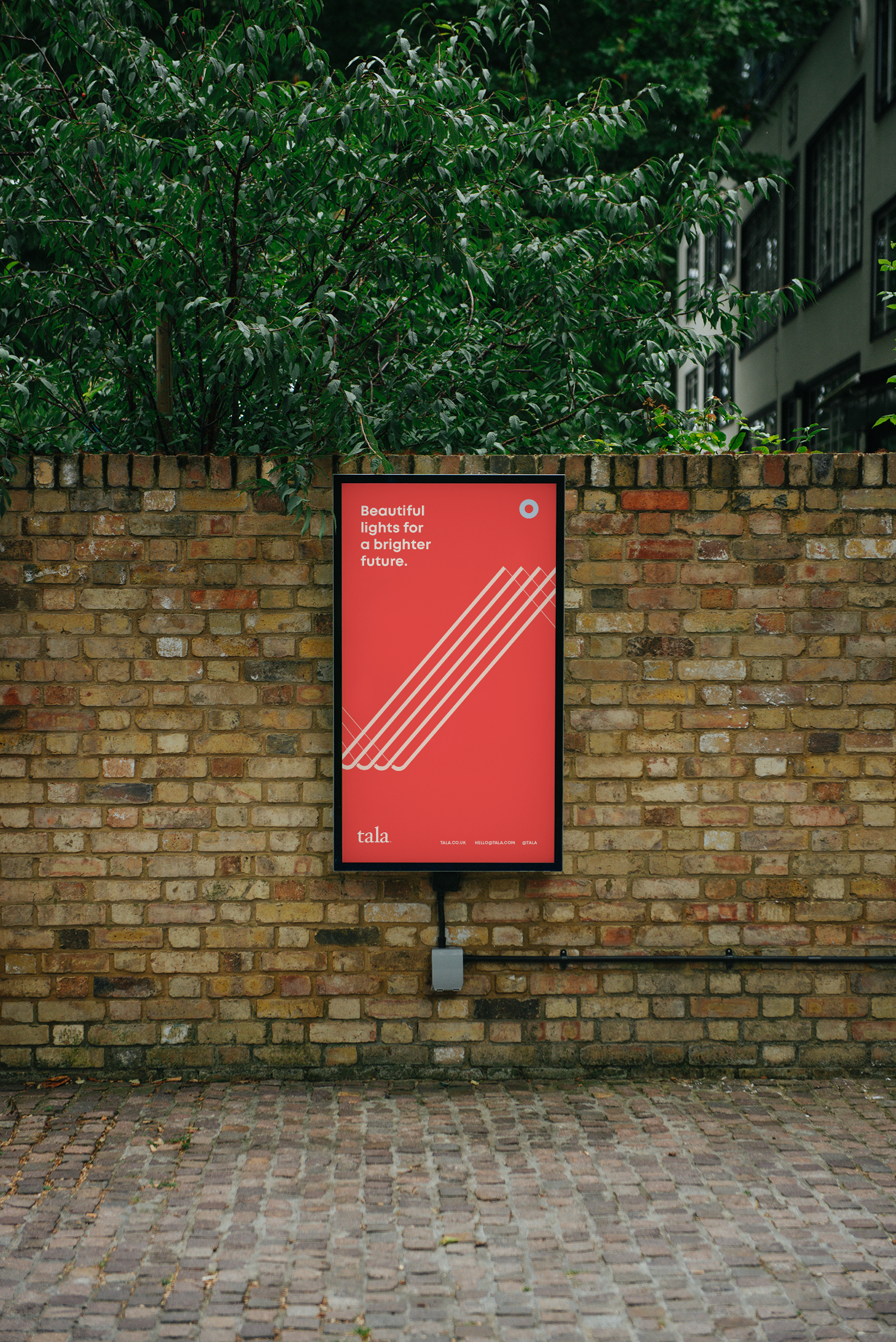Outdoor digital billboard displaying Tala dynamic line graphics, clean typography, and a bright colour palette.