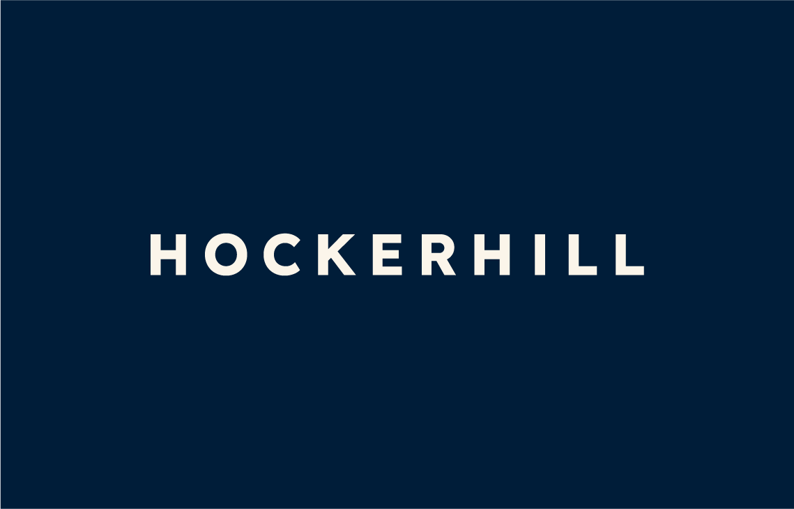 The minimalist white Hockerhill typography wordmark displayed cleanly against a navy backdrop.