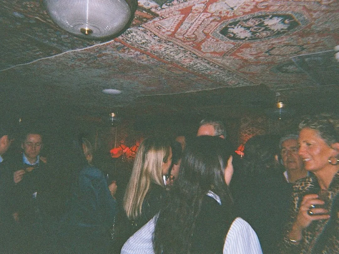 Lifestyle photograph capturing the lively atmosphere and guests at a Wolfschmidt party.