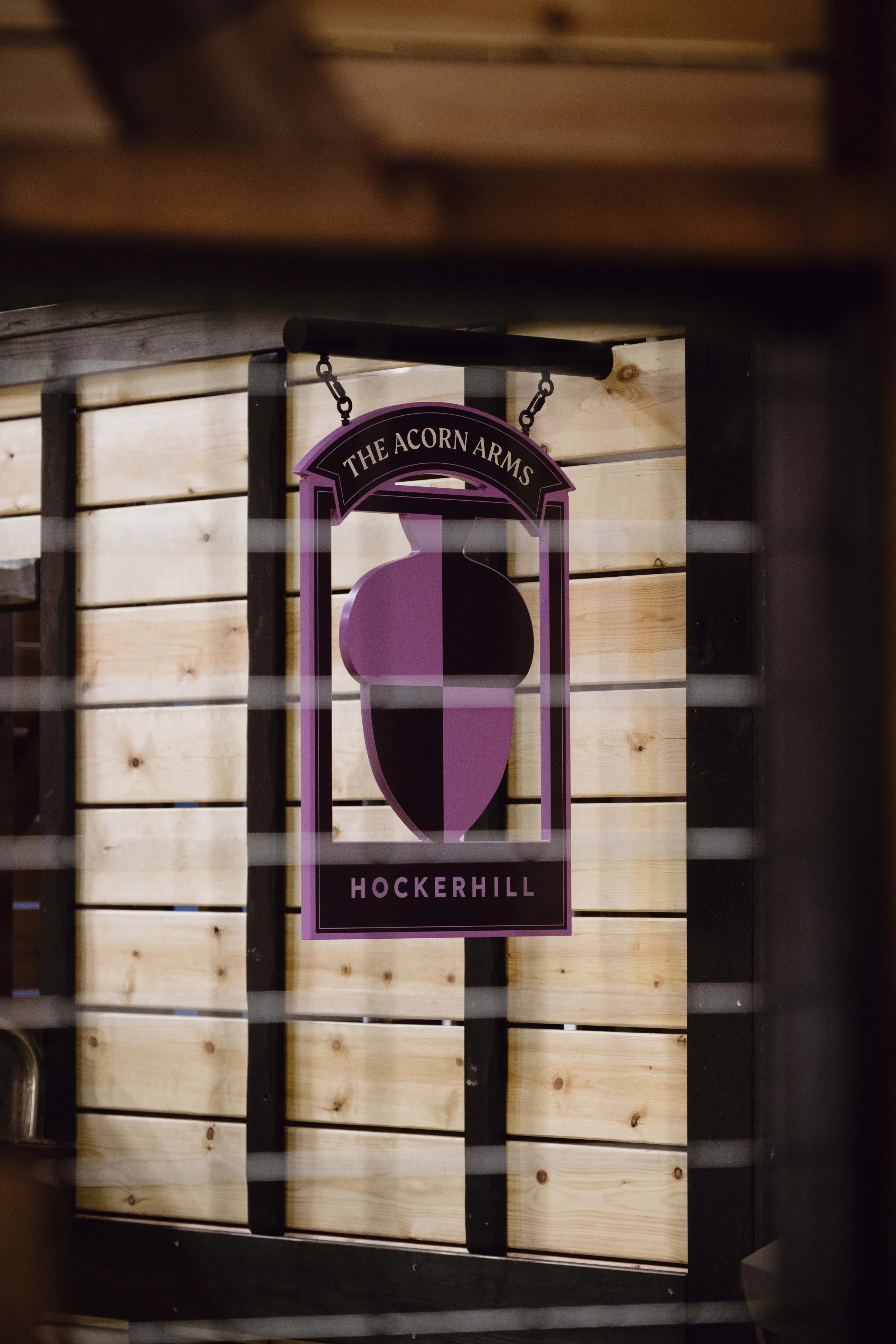 The Acorn Arms bespoke traditional swinging wooden pub sign at Hockerhill Adventure Playbarn.