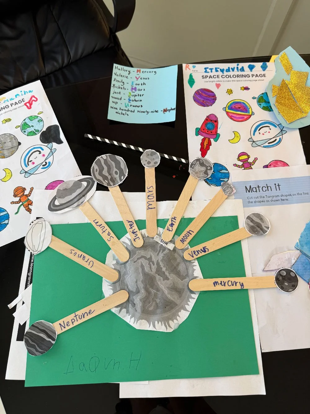 Space-themed student project with planets, colouring pages, and vocabulary activities at Hello Bridge Academy.