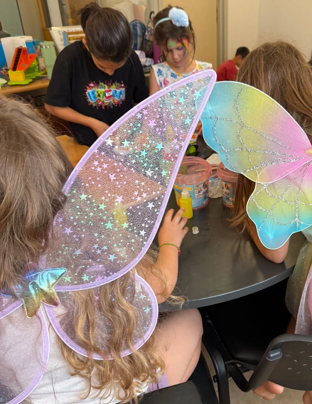 Children taking part in a fairy-themed creative activity at Hello Bridge Academy.