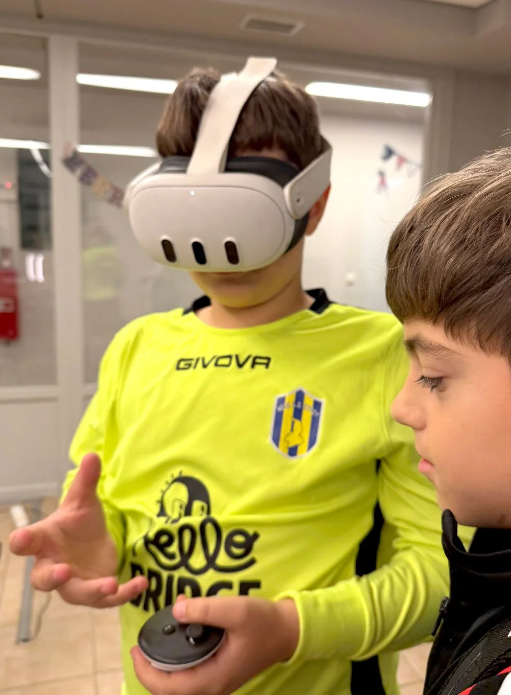 Student using a virtual reality headset during an interactive learning activity at Hello Bridge Academy.