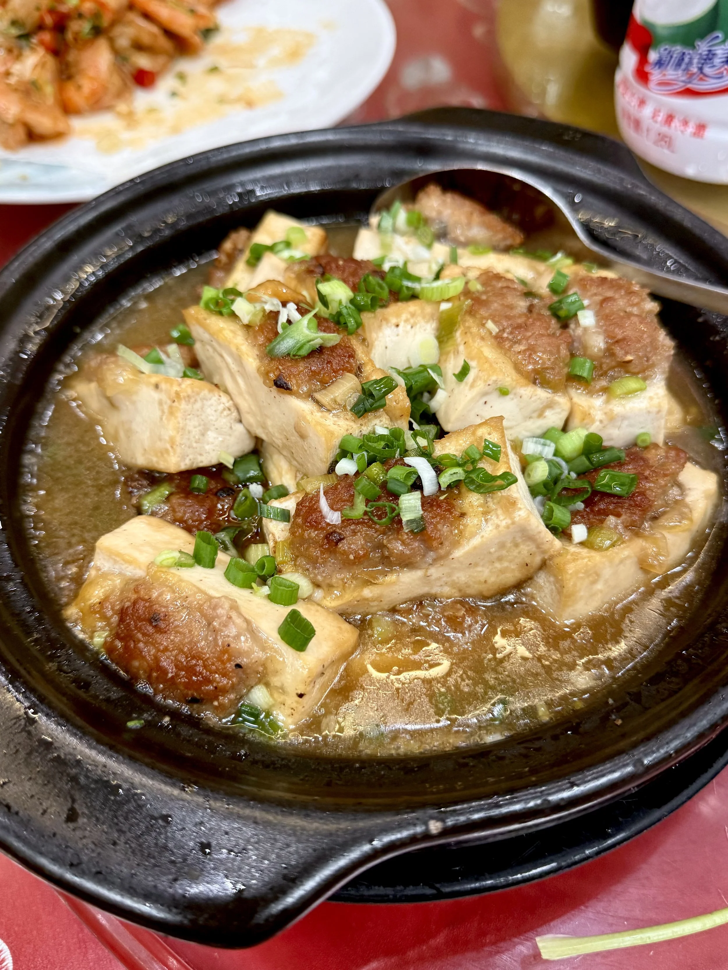 Hakka stuffed tofu, 酿豆腐, with pieces of tofu filled with minced pork and served in a savoury sauce.