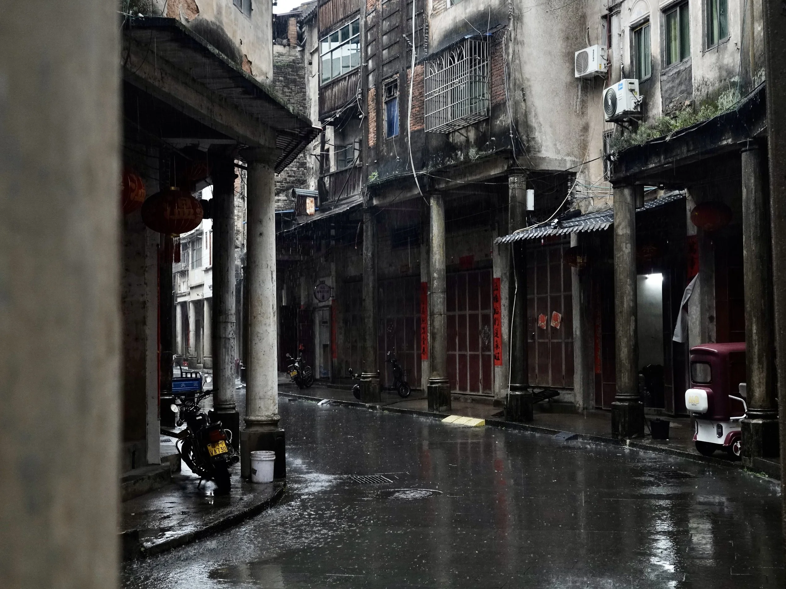 A row of weathered multistorey buildings along an old street in Chayang, Dabu, where the author’s paternal grandmother grew up.