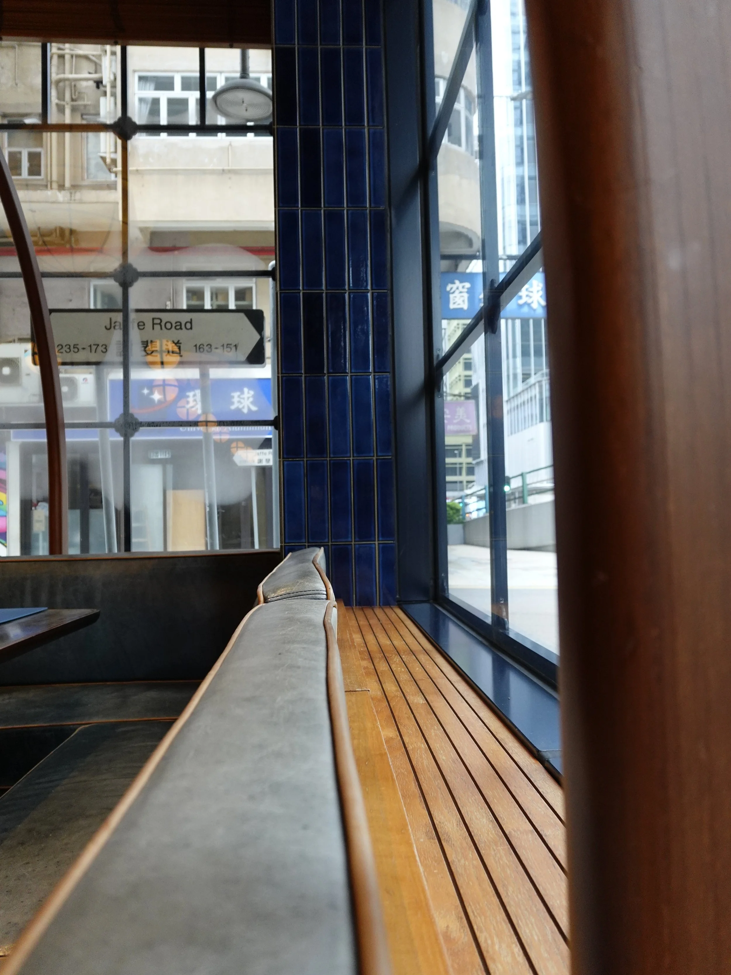 Window seating inside Osteria Marzia looking onto a street in Wan Chai Hong Kong