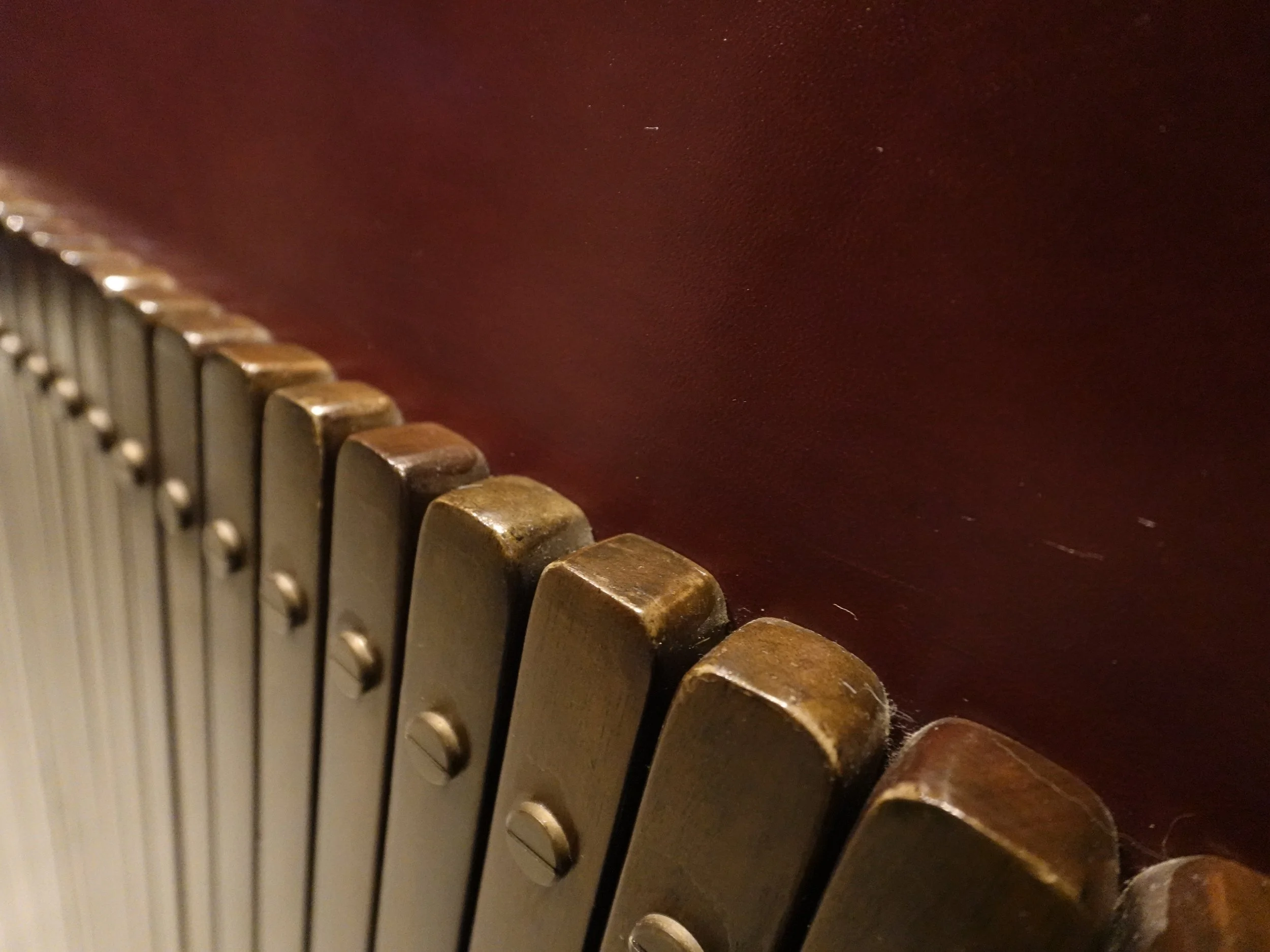 Close\-up of aged brass ribs and screws on the concierge desk at The Fleming