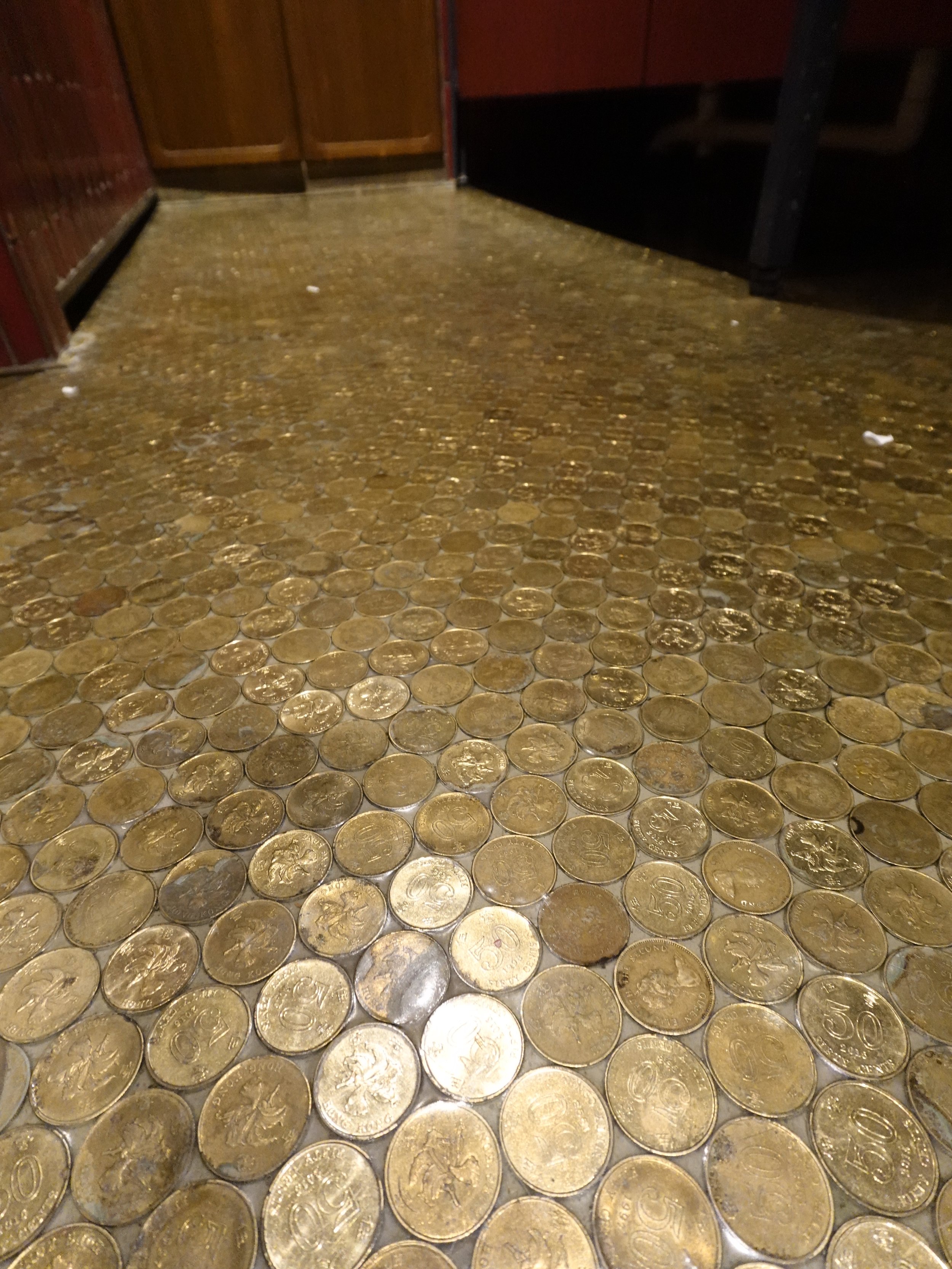 Hong Kong 50-cent coins embedded into flooring at The Fleming hotel