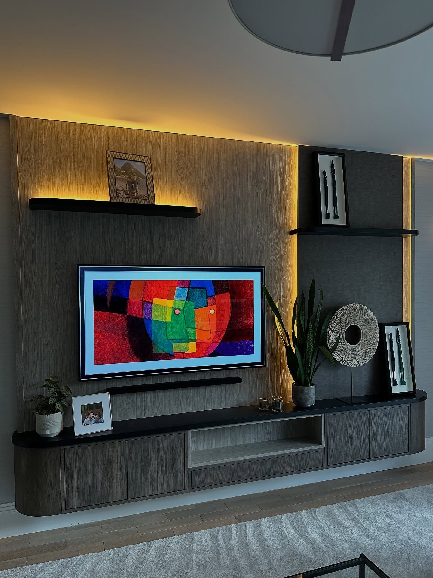 Here&rsquo;s a few stills of one of the recent installs.

This media wall has a sleek, contemporary design with warm ambient lighting and a refined mix of textures.

Curved ends with mitred cornered units. I don&rsquo;t trust butt joints&hellip; they