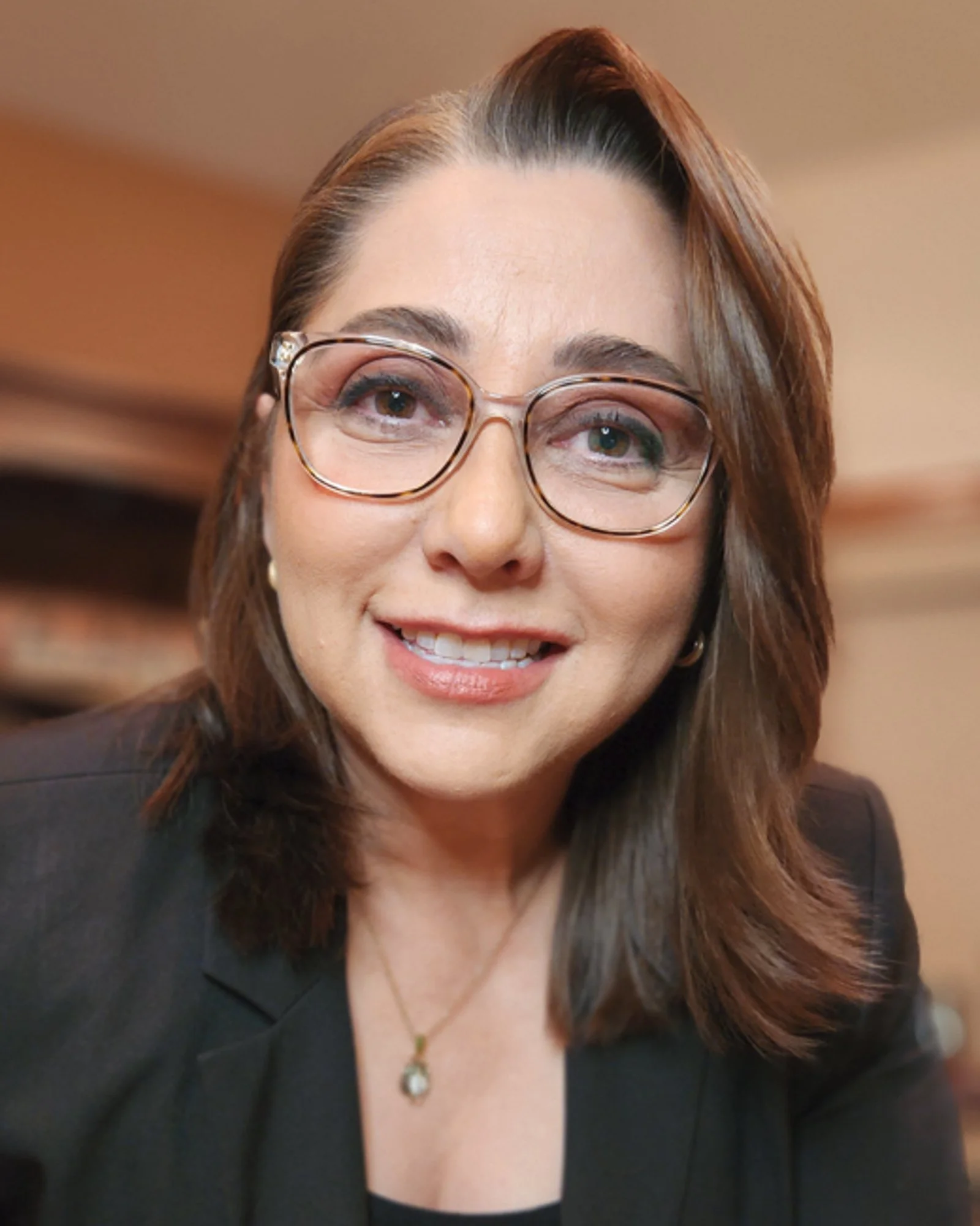 A portrait of Nora Díaz, Josh's co-host at the AI in translation summit. The AI in Translation Summit is a FREE virtual event for translators diving deep into the industry-specific aspects of AI so you can stay relevant, and thrive