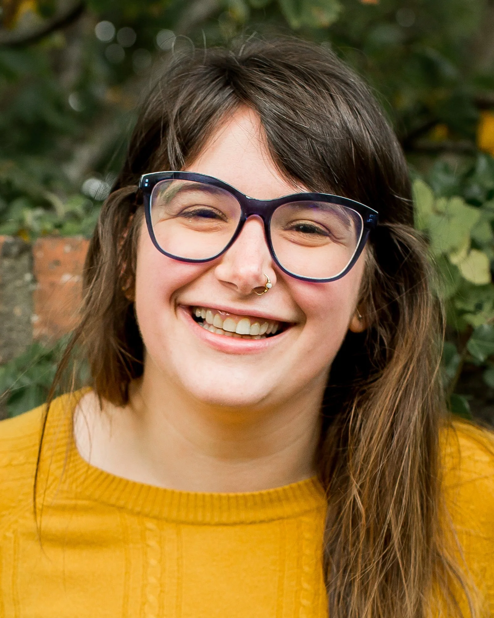 A portrait of Bex Elder, a speaker at the AI translation summit. The AI in Translation Summit is a FREE virtual event for translators diving deep into the industry-specific aspects of AI so you can stay relevant, and thrive