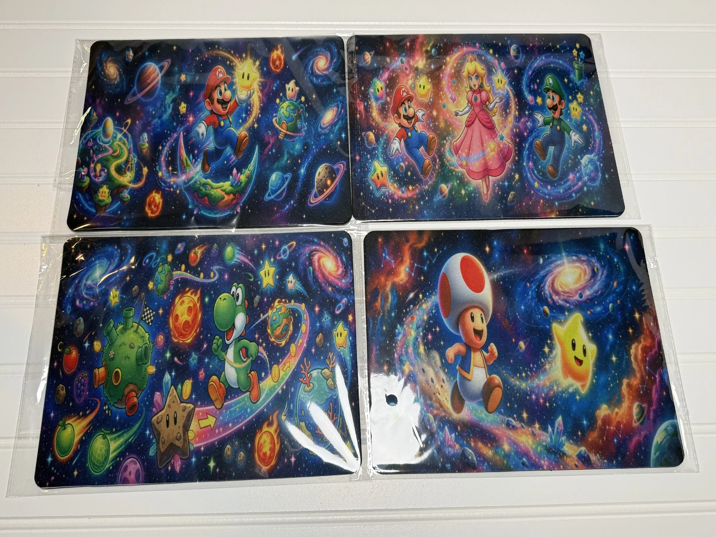 Colorful fantasy scene featuring Mario, Luigi, Princess Peach, and Toad surrounded by stars, planets, and cosmic elements in space.