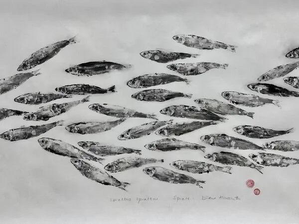 Gyotaku print of a school of fish swimming together.