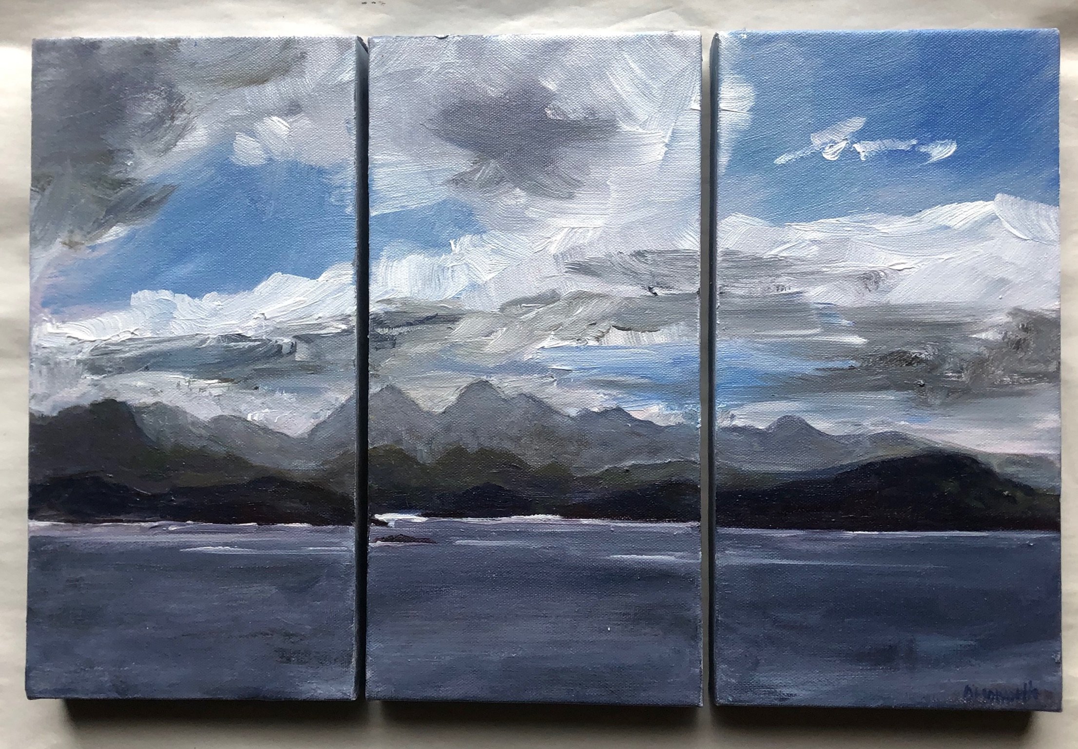Triptych landscape painting of a cloudy sky over mountains with dark foreground, created with loose brushstrokes in shades of gray, blue, and white.