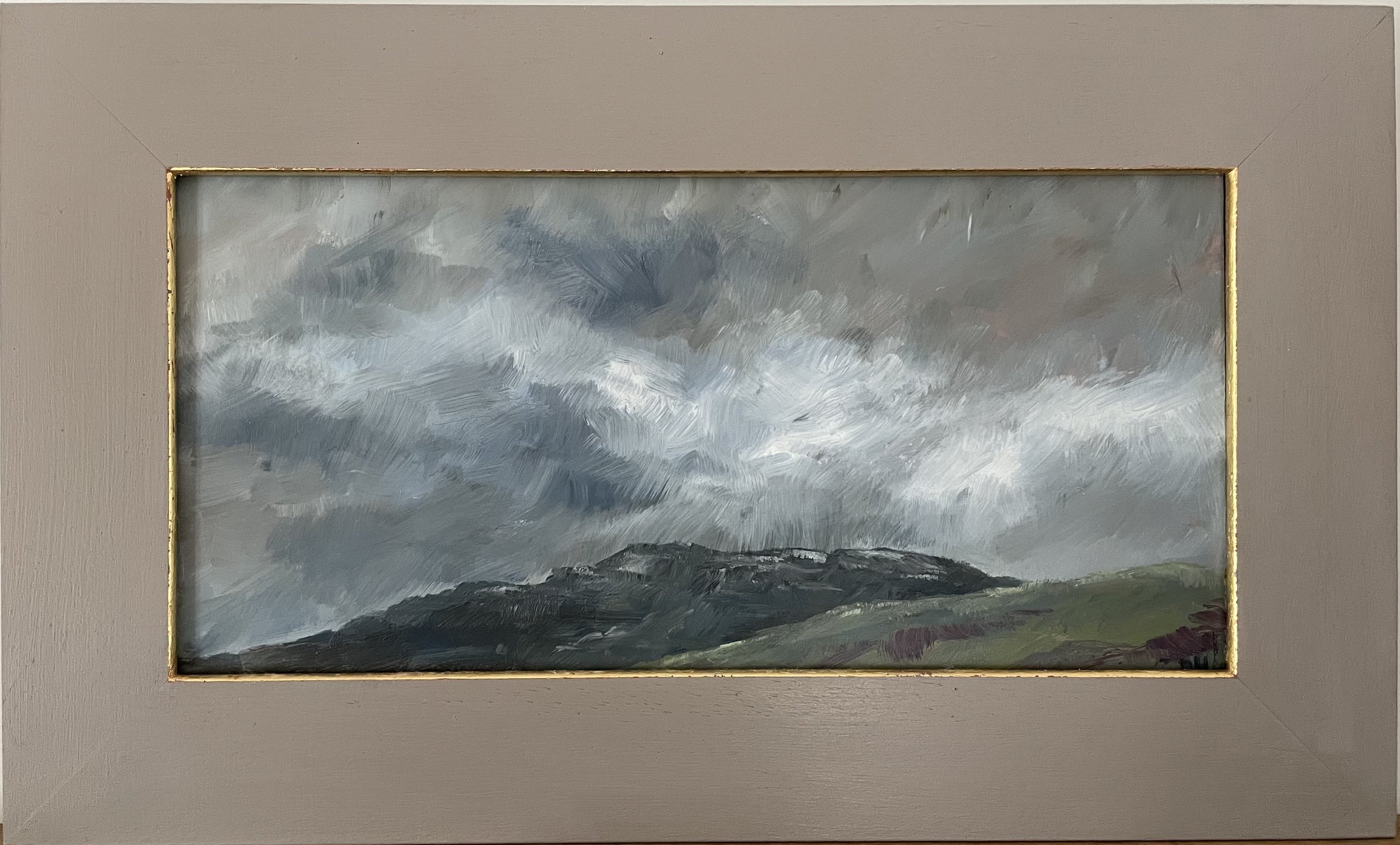 A painting of a stormy sky over a hilly landscape, with dark clouds and a sense of movement in the brushstrokes.
