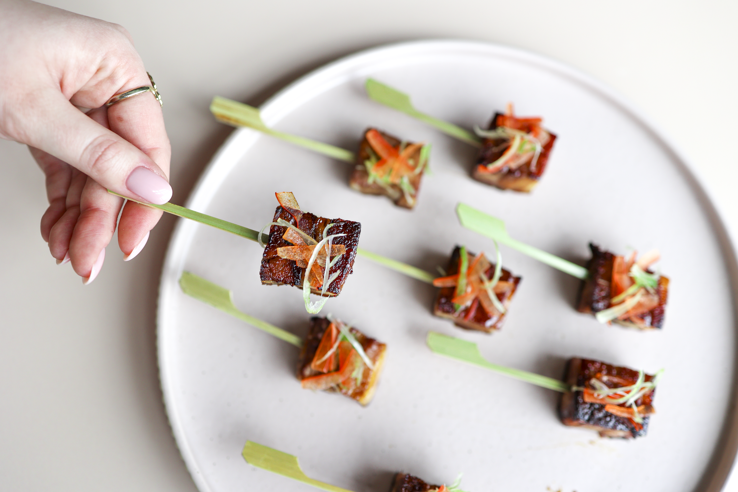 Bite-sized canapés from SS 26 menu combining bold flavours, refined garnishes and elegant presentation for stylish receptions and events