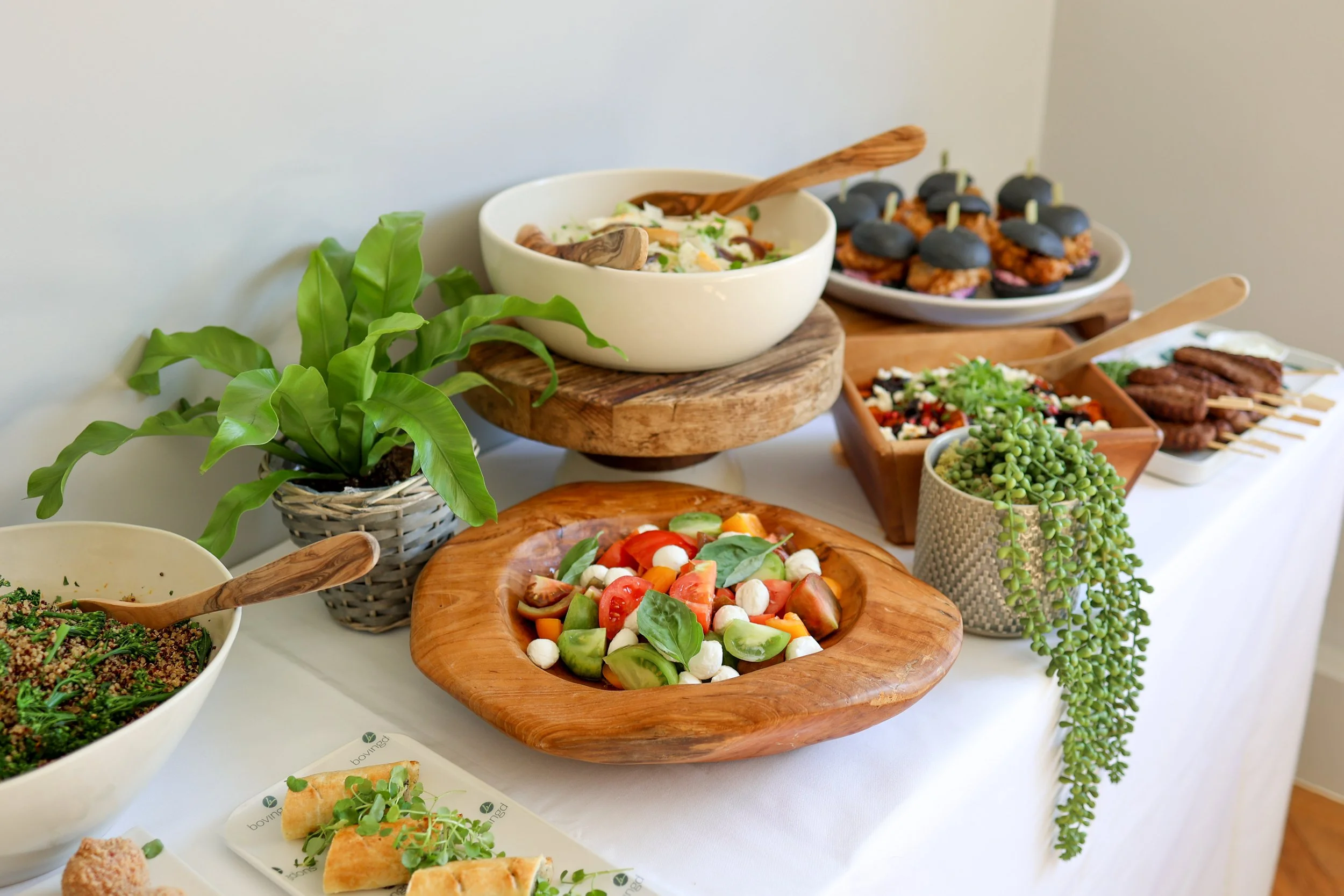 A buffet display featuring vibrant seasonal salads, handcrafted canapés and contemporary sharing dishes, perfect for relaxed yet elevated event dining.
