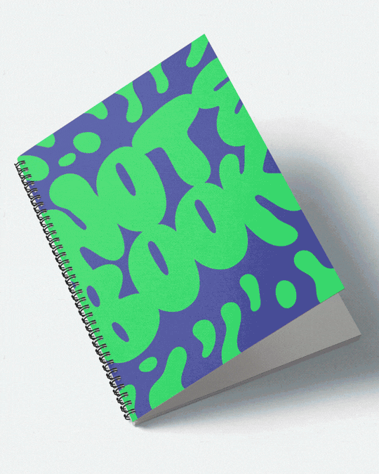 A spiral-bound notebook with a colorful abstract cover design featuring green and blue shapes.