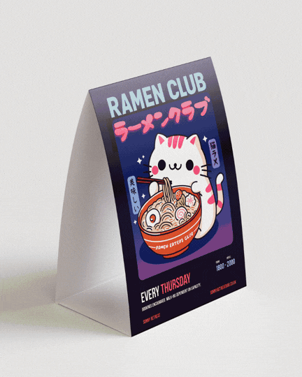 A tabletop sign promoting Ramen Club with a cartoon cat holding a bowl of ramen, featuring Japanese characters and vibrant colors.