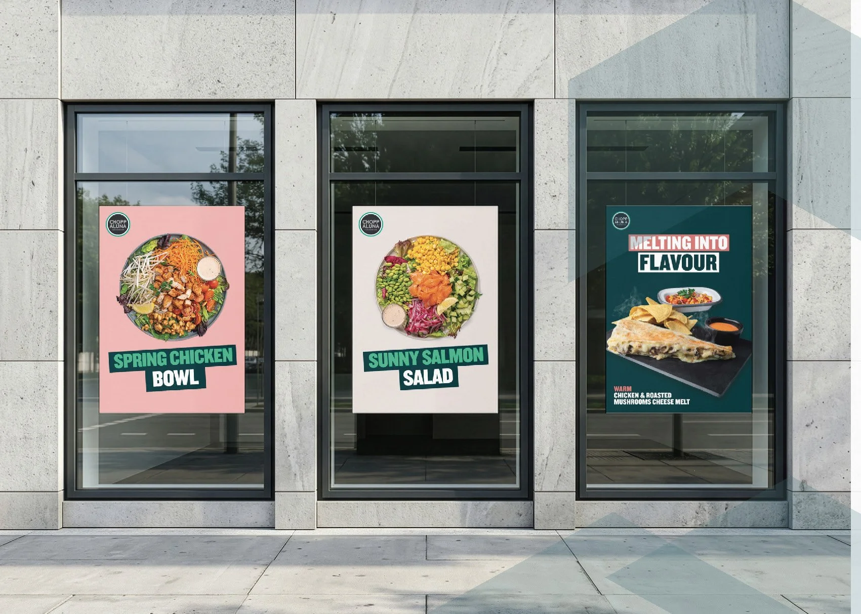 Three storefront posters advertising food items, including a spring chicken bowl, a sunny salmon salad, and melting into flavor pizza, with images of each dish and related ingredients.