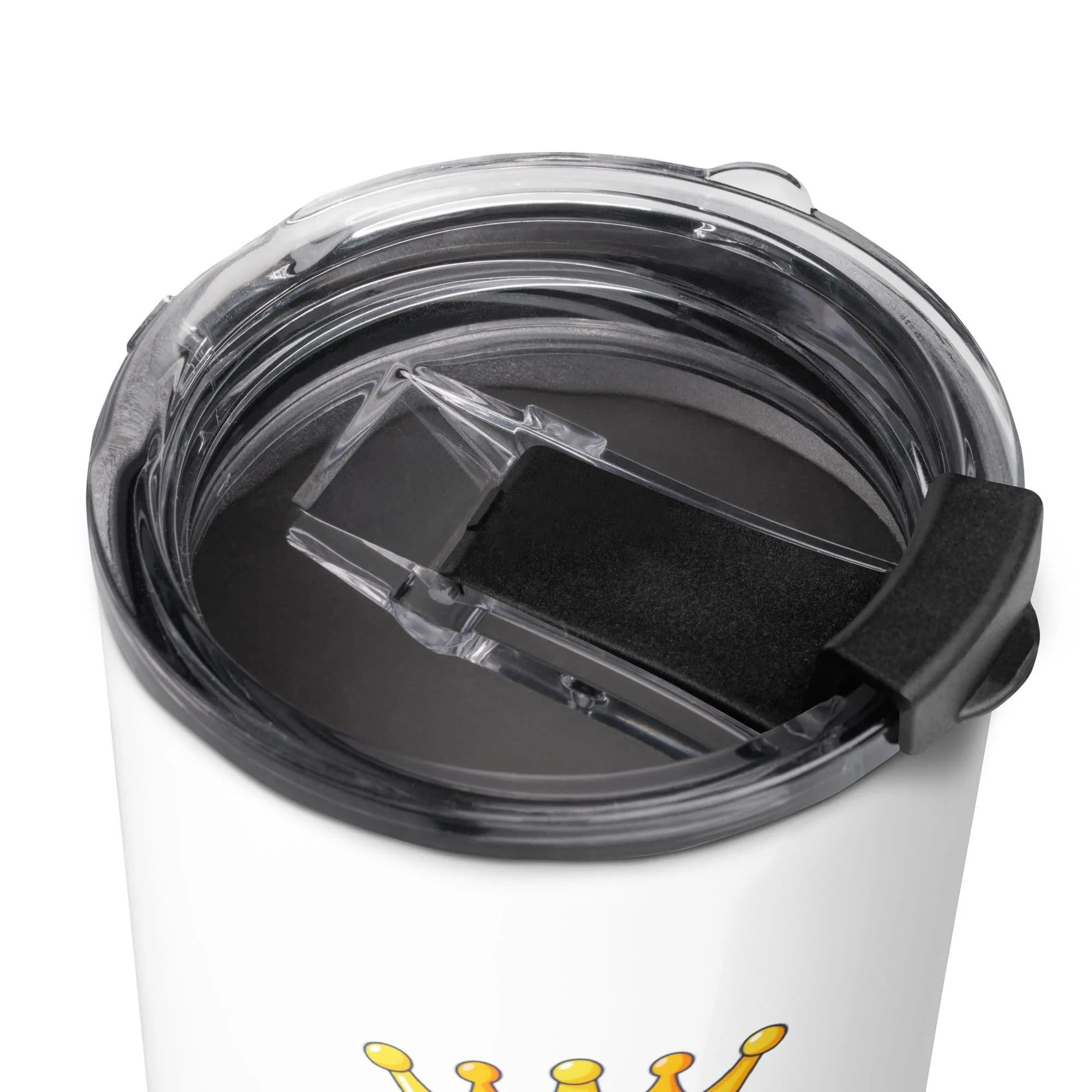 Close-up of a travel mug with a transparent, black-lidded sliding cover and part of a yellow crown graphic visible on the cup.