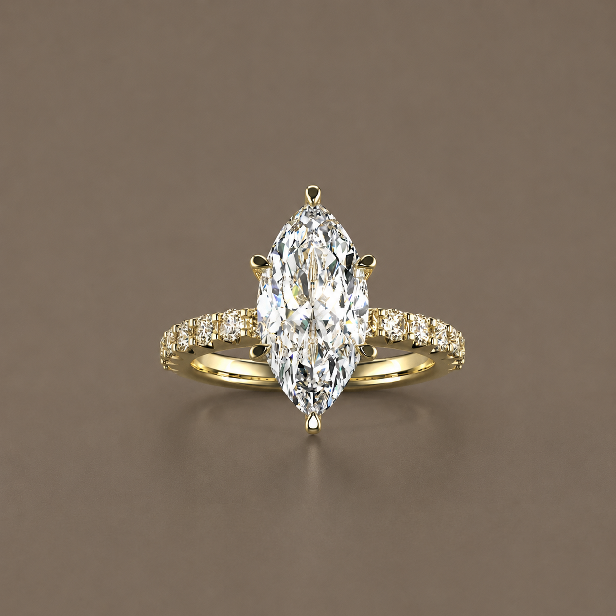 Luxury gold ring with a large marquise-cut diamond centerpiece and smaller diamonds on the band, displayed against a plain background.