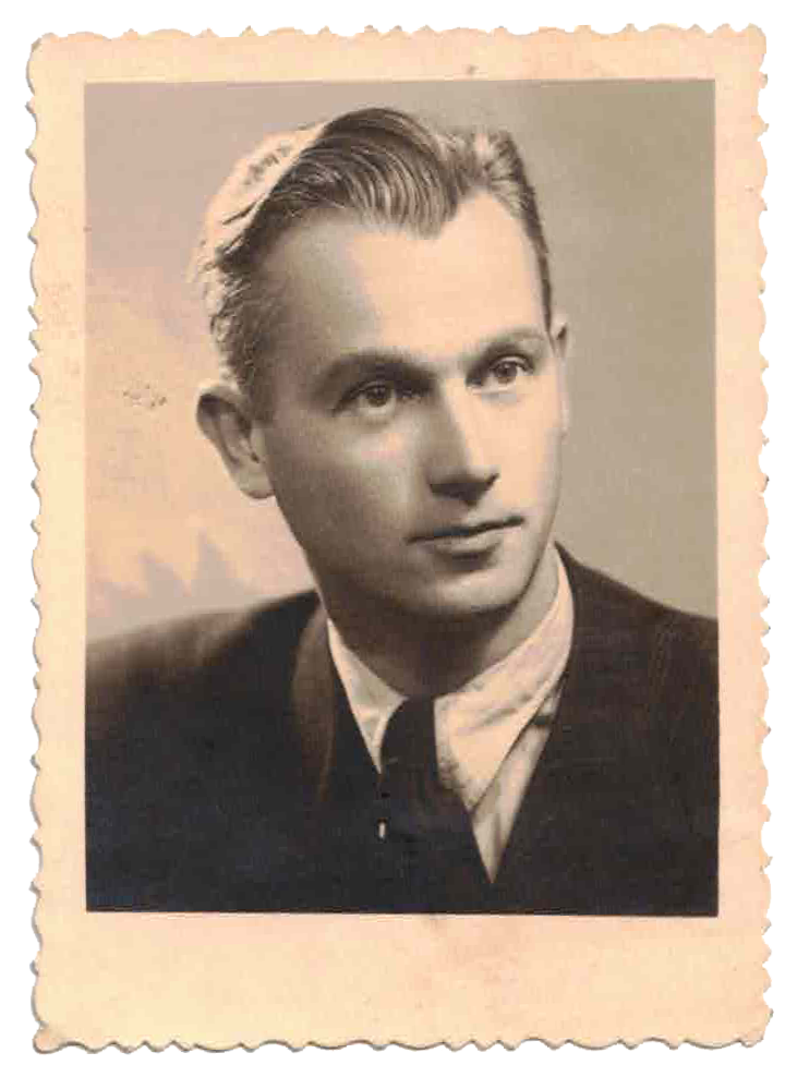 Black and white portrait of a young man with slicked-back hair, wearing a suit and tie, vintage style photograph