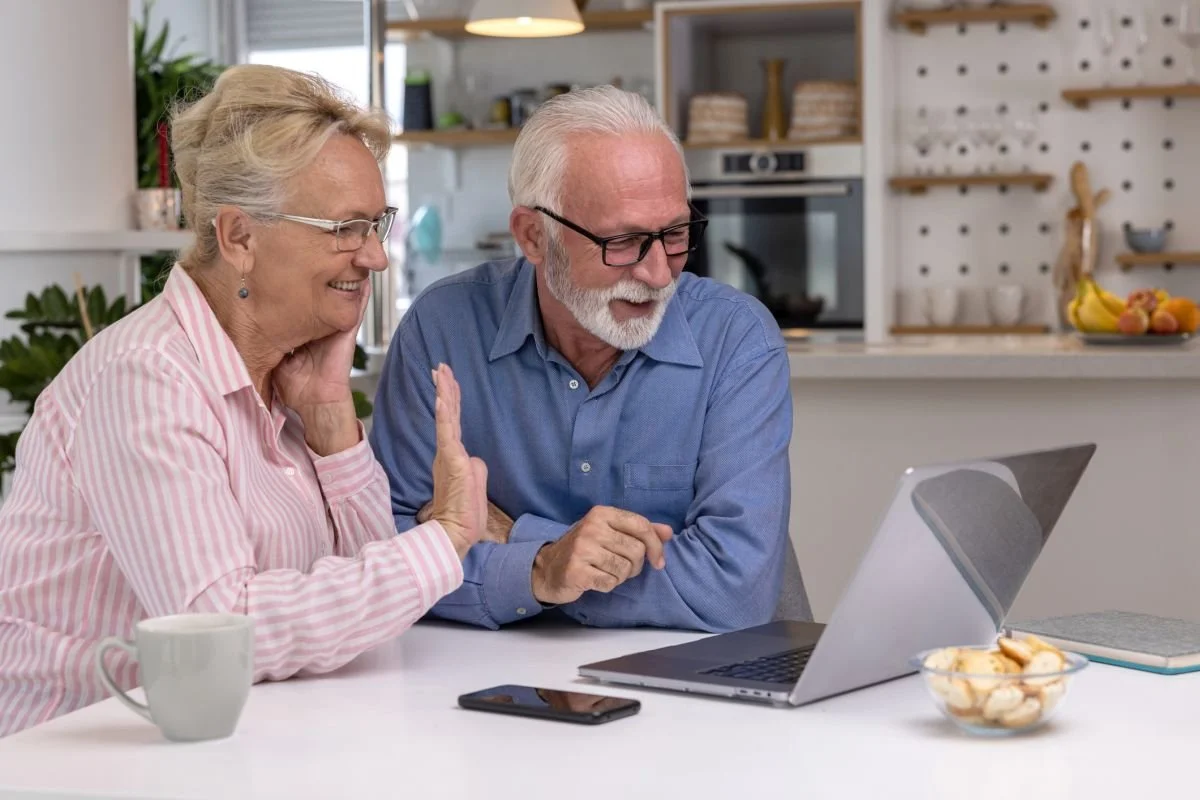 Two seniors enjoying computer time