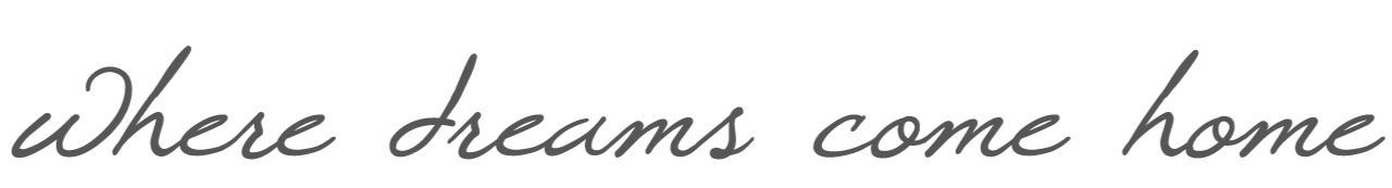 Text reading 'Where dreams come home' in gray cursive font on a transparent background.