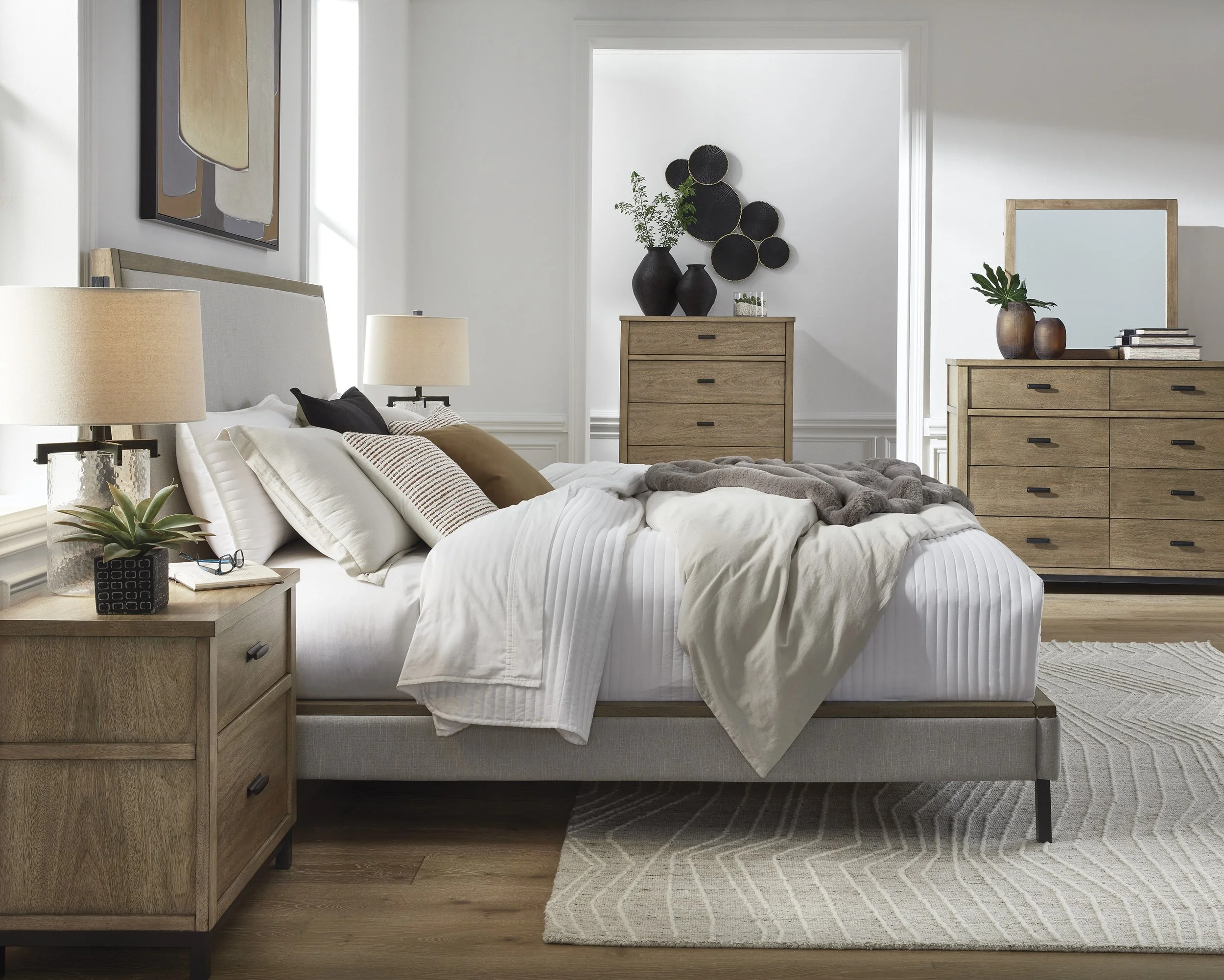 Bedroom set with upholstered bed, light oak dresser and nightstands from WorldWide Furniture