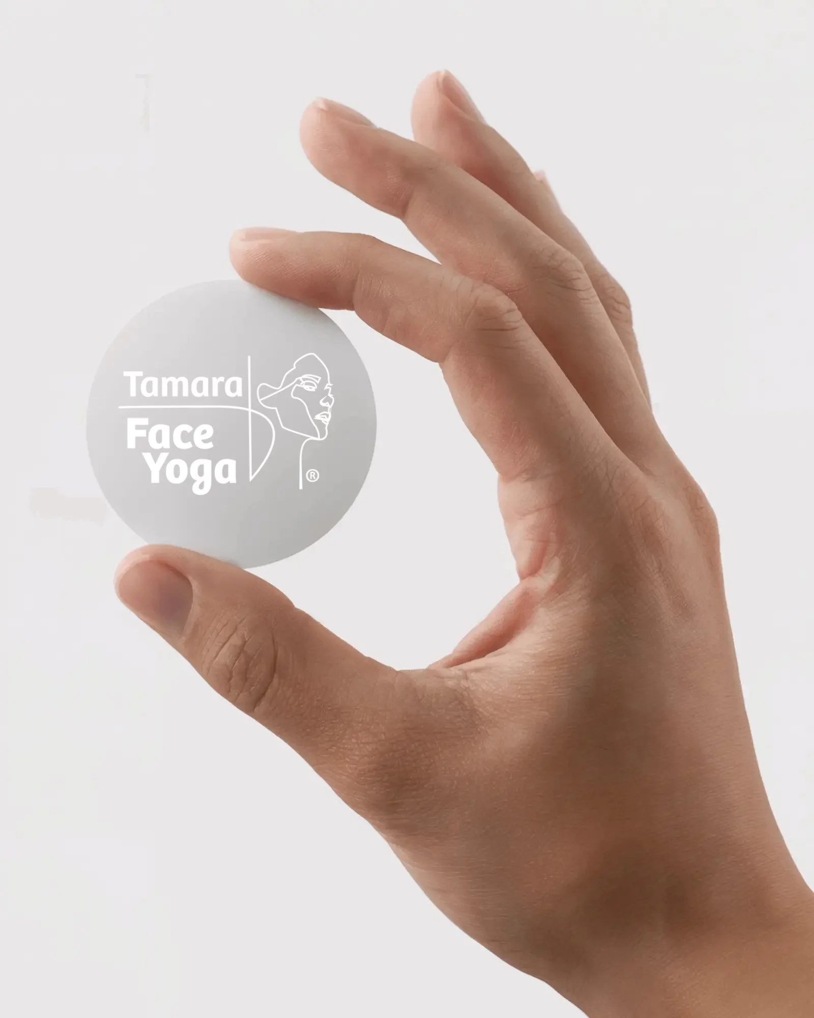 handheld-round-sticker-mockup-blank-circular-label-held-between-fingers-clean-white-background-0725.jpg