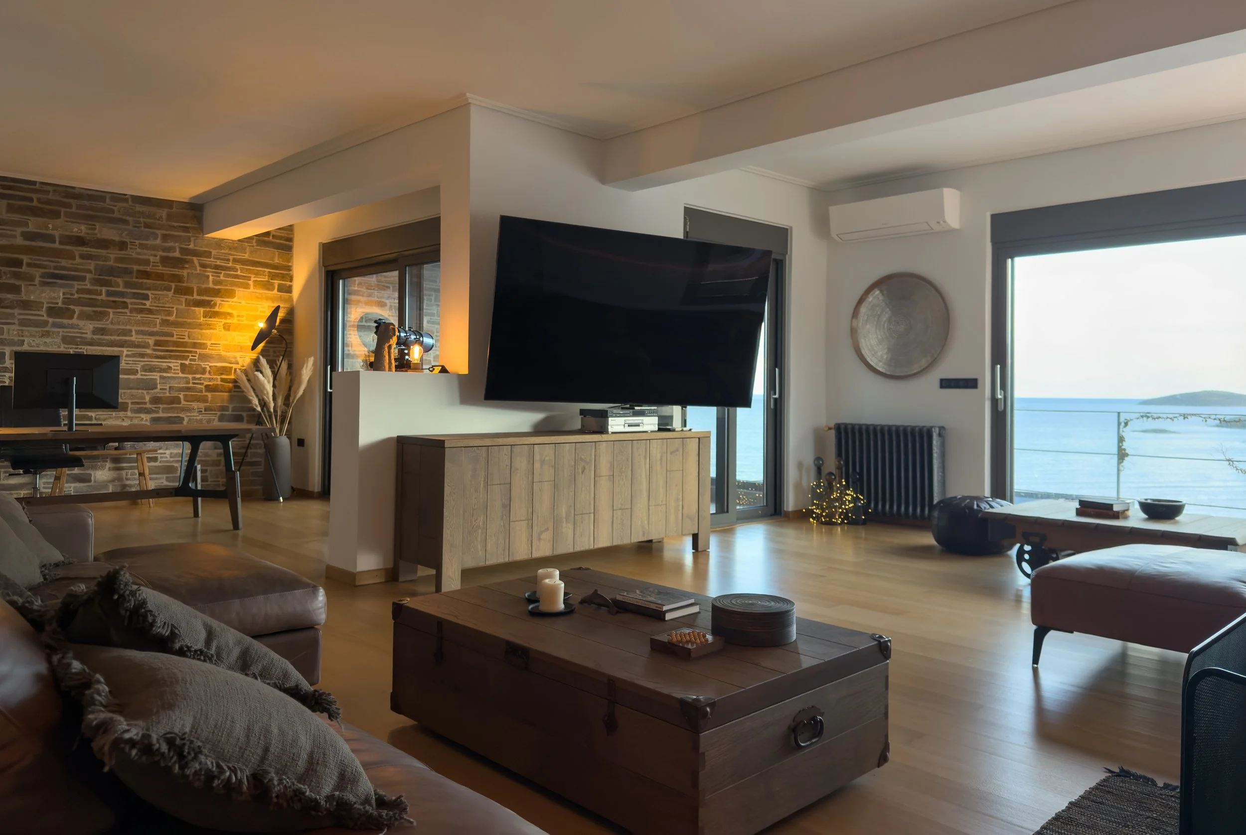 Relaxed living atmosphere inspired by warmth, gathering and coastal contemporary living at Astraea Villa.