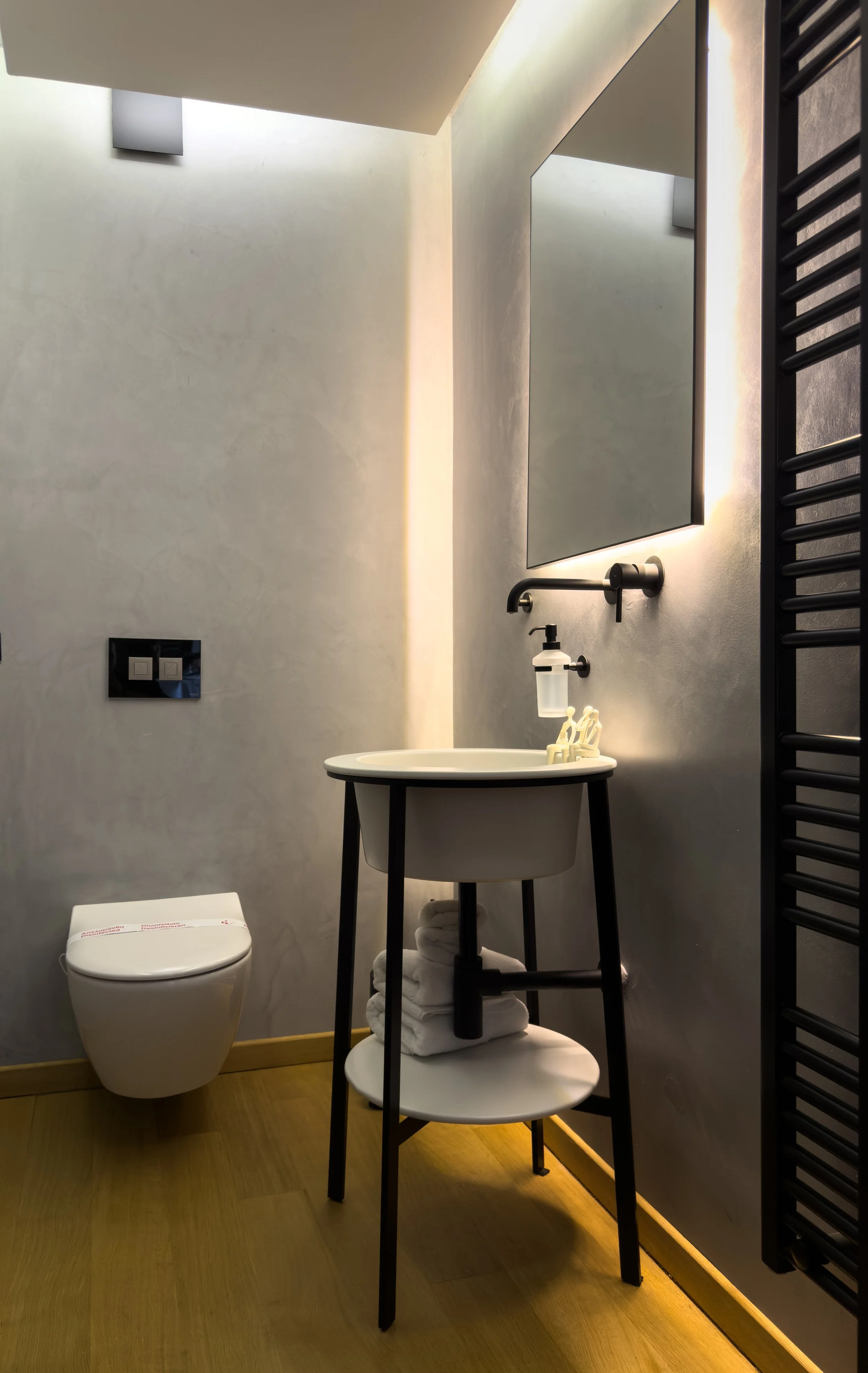 Thoughtfully designed bathroom interiors with layered materials and refined minimalist character at Astraea Villa.
