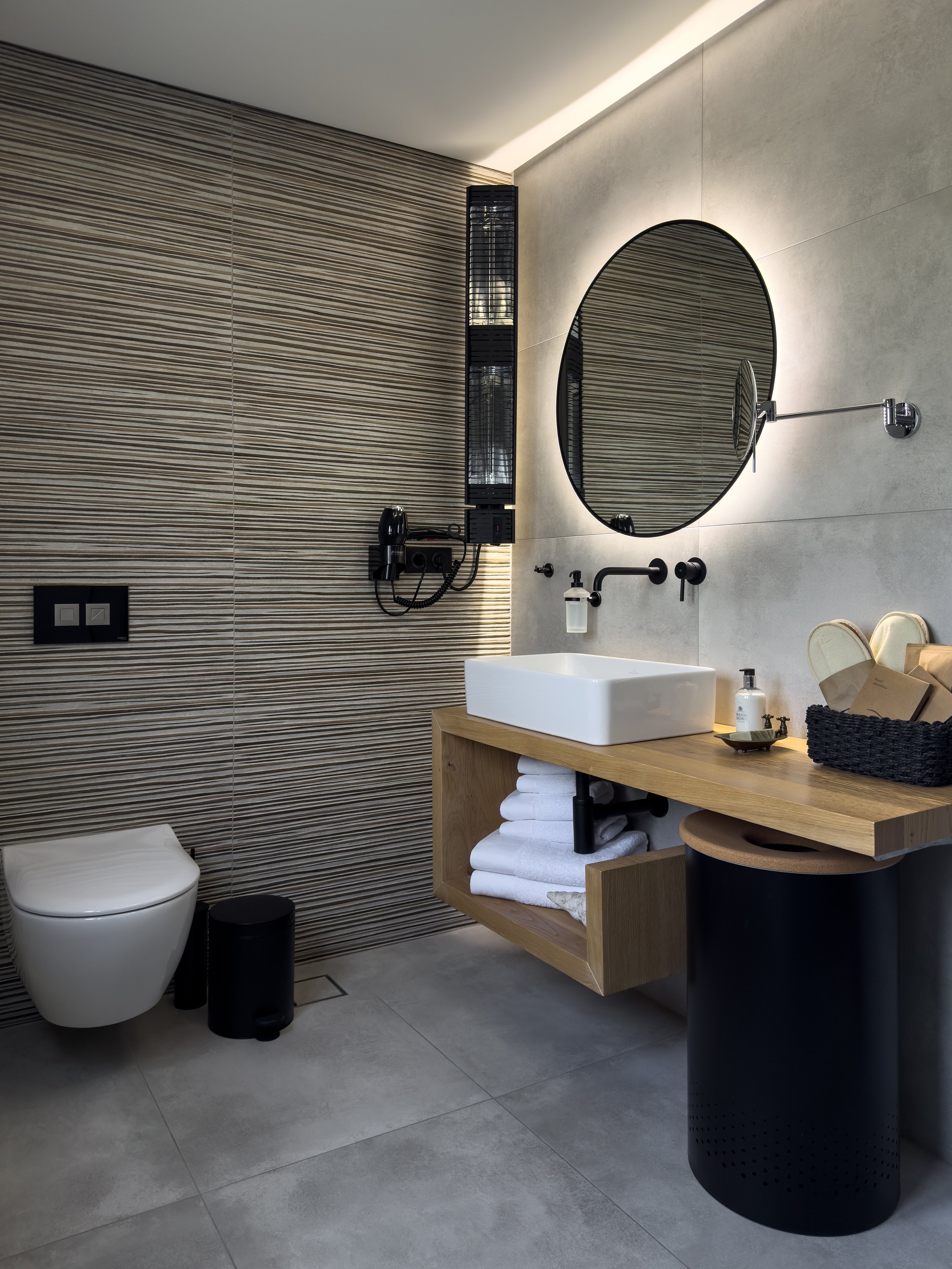 Bathroom spaces inspired by natural materials and relaxed contemporary living at Astraea Villa.