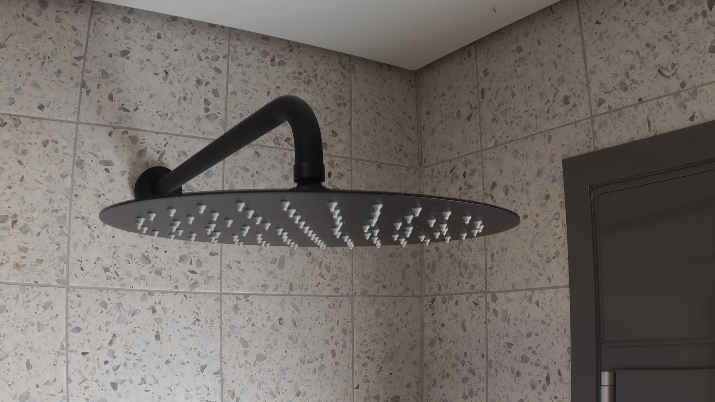 Refined bathroom surfaces inspired by contemporary Mediterranean simplicity at Astraea Villa.