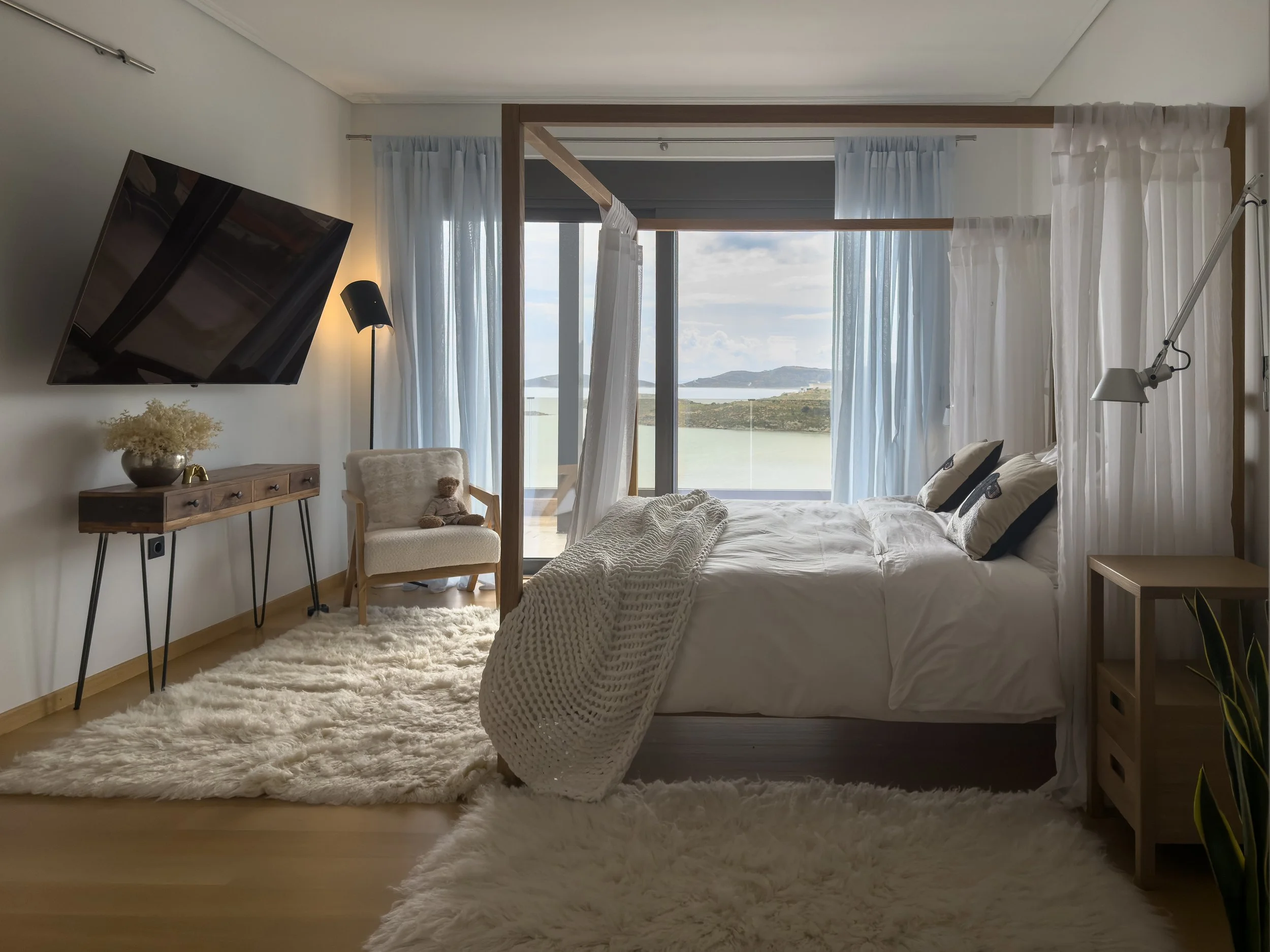 Bedroom spaces shaped by softness, light and the rhythm of coastal living at Astraea Villa.